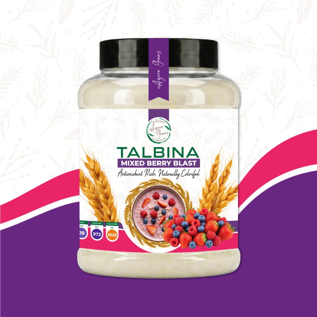 Mixed Berry Blast Talbina by Azura Grains – strawberry, raspberry, and blueberry flavored barley porridge in a bowl topped with fresh berries