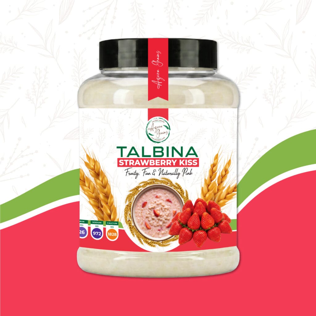 Strawberry Kiss Talbina by Azura Grains – naturally pink strawberry-flavored barley porridge in a bowl with fresh strawberry slices